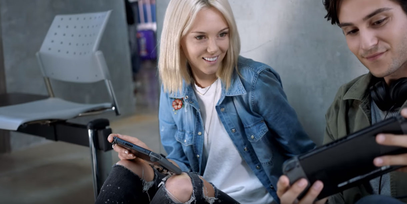 I too played my Switch sitting against a wall at an American airport. Only I was alone and exhausted, not sharing the moment with a cute stranger.